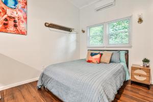 a bedroom with a bed and a window at The Moon Loft in Atlanta