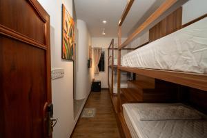 a hallway with two bunk beds in a room at Hotel Thanh Van 2 in Tuy Hoa