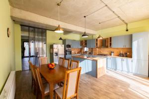 a kitchen and dining room with a table and chairs at GM - Guesthouse in Choporti +28 photos