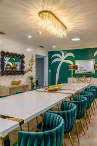 a large conference room with a long table and chairs at Sleeps36 2Homes 12BR Heated Pool Spa Pickleball 14 Parking in Clearwater