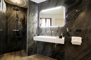 a bathroom with a sink and a mirror at Affittacamere Ca Stella Antares a La Morra centro in La Morra