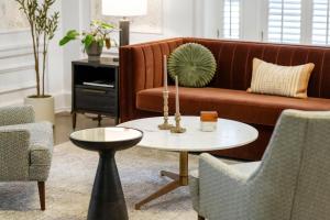 a living room with a couch and a table at Kasa Capitol Hill Downtown Nashville in Nashville +9 photos