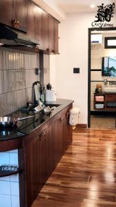 a kitchen with a sink and a counter top at CozyhomeDaLat in Khu Chi Lăng