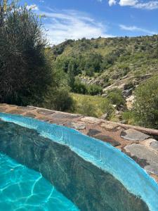 a swimming pool with a view of a mountain at Villa Pellegrini in Trapiche