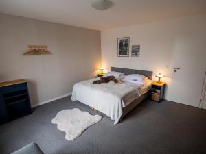 a bedroom with a dog laying on a bed at Residence Sarka in Prague
