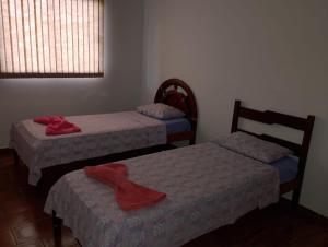 Giường trong phòng chung tại Real Hotel do Tatico