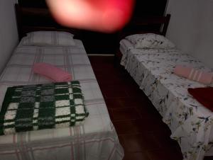 Giường trong phòng chung tại Real Hotel do Tatico