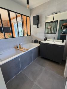 a large bathroom with a tub and a sink at Alice's Studio and Oasis in Poitiers +27 photos
