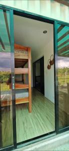 a glass window of a room with a bunk bed at Wengsmont in Tubod