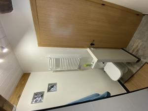 a bathroom with a toilet and a sink at Ático en Jaca in Jaca +37 photos