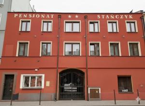 a red building with the words permanent landmark on it at Pensjonat Stańczyk in Krakow