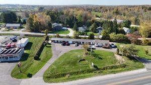 an aerial view of a house and a road with a building at Sunrise Motel in Owen Sound