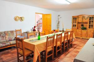 a dining room with a table and chairs at Masia Campos Culla in Culla