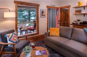a living room with a couch and a table at Backwoods Cabins in Carson