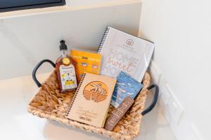 a basket filled with books and other books at Villa De Vida Luxury Accomodations in Tangolunda