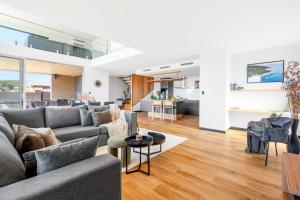 a living room with a couch and a table at The Lookout, Albany Holiday House in Albany