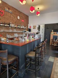 a bar in a restaurant with a brick wall at Schijnpoort in Antwerp