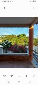 a window with a view of a garden at Alto Astral in Fortaleza
