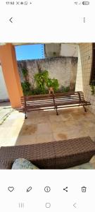 two benches sitting on a sidewalk in a building at Alto Astral in Fortaleza
