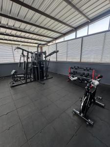 a gym with two exercise bikes in a room at HOTEL NABU VALLEDUPAR in Valledupar