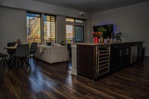 a kitchen and living room with a counter and a living room at Downtown views by the Lake in Austin