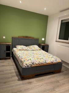 a bedroom with a bed in a room at Chez David & Magali in Dommartin-lès-Remiremont