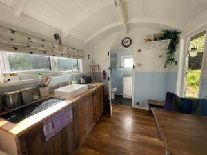 a kitchen with a sink and a counter top at Tor Royal Farm House in Princetown