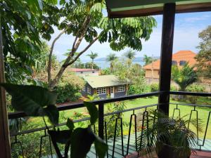 a view from the window of a house at Surjios Guest House in Jinja