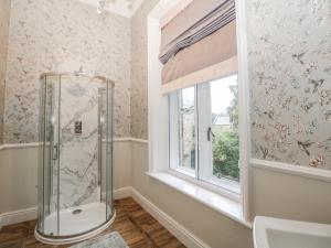 a bathroom with a shower and a window at Hallfield Hall in Alfreton +90 photos