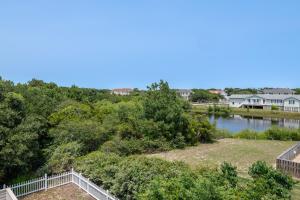 a view of the river from the balcony of a house at Beach Cabana - Southern Shores, 6 En-Suites, Elevator, Pool, Cabana Bar, Hot Tub, Game Room in Southern Shores
