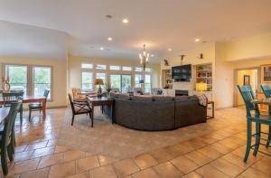 a living room with a couch and a table at Beach Cabana - Southern Shores, 6 En-Suites, Elevator, Pool, Cabana Bar, Hot Tub, Game Room in Southern Shores