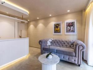 a living room with a couch and a table at Palace by Wynwood House in Bogotá