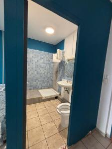 a bathroom with a toilet and a sink at Cayenne Centre Eco Castor in Cayenne +23 photos