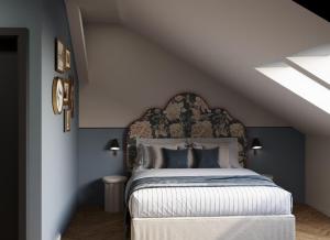 a bedroom with a large bed in a attic at Maroon & Moss Residence in Budapest