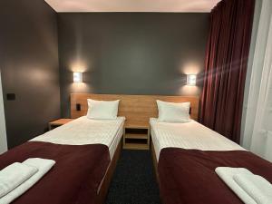 a small room with two beds in a room at HOUSE silver in Ivano-Frankivsk +16 photos
