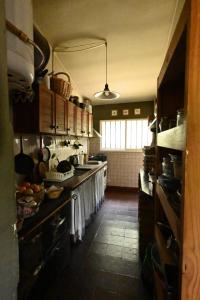 a large kitchen with a large counter topropheropheropheropheropheropheropherophe at Casa Amaranta in La Cumbre