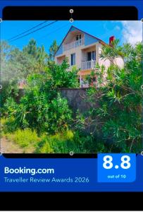 a picture of a house with trees at Large house at the beach. in Grigoleti