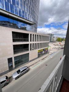 a car is parked in front of a building at Studio moderne et confort - Guillemins in Liège