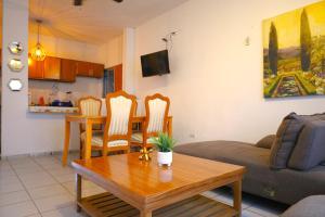 a living room with a couch and a table at Entire accommodation in Bahia de la Paz in La Paz