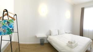 a bedroom with a bed with a towel on it at AAA plus in Nordeste