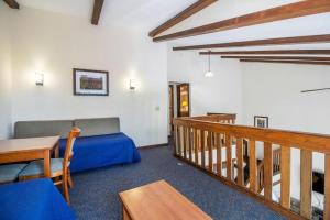a living room with a couch and a table at Mountainside Villas in McGaheysville