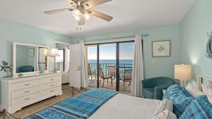 a bedroom with a bed and a view of the ocean at Gull Watch by AvantStay in Panama City Beach +47 photos