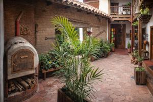 an indoor garden with plants in a building at Casona Rosa Lorenza in Corrales