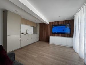 a living room with a tv on a wall at Luxury self-contained guest suite in Gold Coast