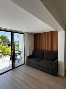 a living room with a couch and a table at Luxury self-contained guest suite in Gold Coast