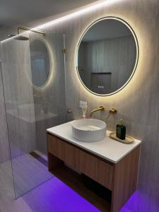 a bathroom with a sink and a mirror at Luxury self-contained guest suite in Gold Coast