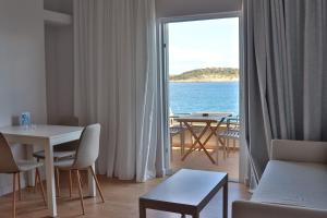 a living room with a view of the ocean at 9 Muses Apartments in Agios Nikolaos