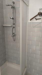 a shower with a glass door in a bathroom at Borgo marino litorale salus in Sciacca +3 photos