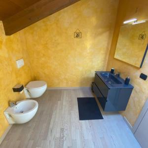 a bathroom with a sink and a toilet at Villa Fiesta in Oggiono +46 photos