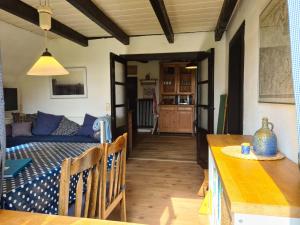 a living room with a couch and a table at Bauernhaus Sehestedt in Sehestedt